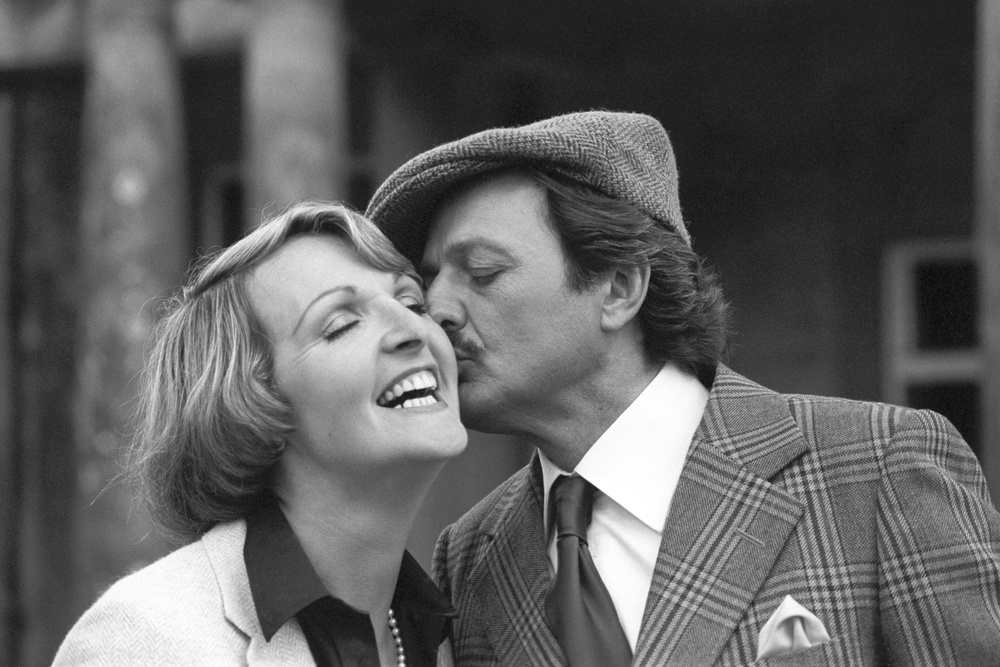 Sharing a kiss with co-star Peter Bowles from the sitcom To The Manor Born in 1981 which was revealed as one the top three most popular programmes in the history of British television at the time (PA) (PA Archive)