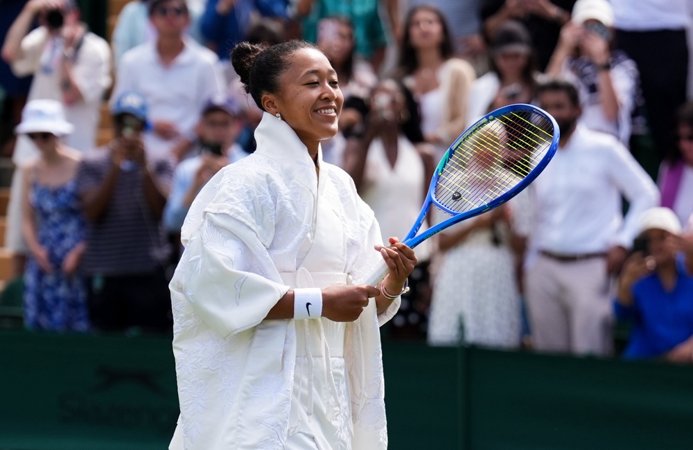 Naomi Osaka sported an outfit inspired by traditional Japanese dress as she played her first-round match at Wimbledon (PA)