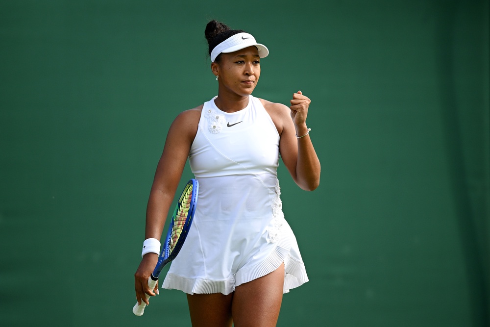 Osaka wore a white dress underneath her walk-on outfit (Getty)