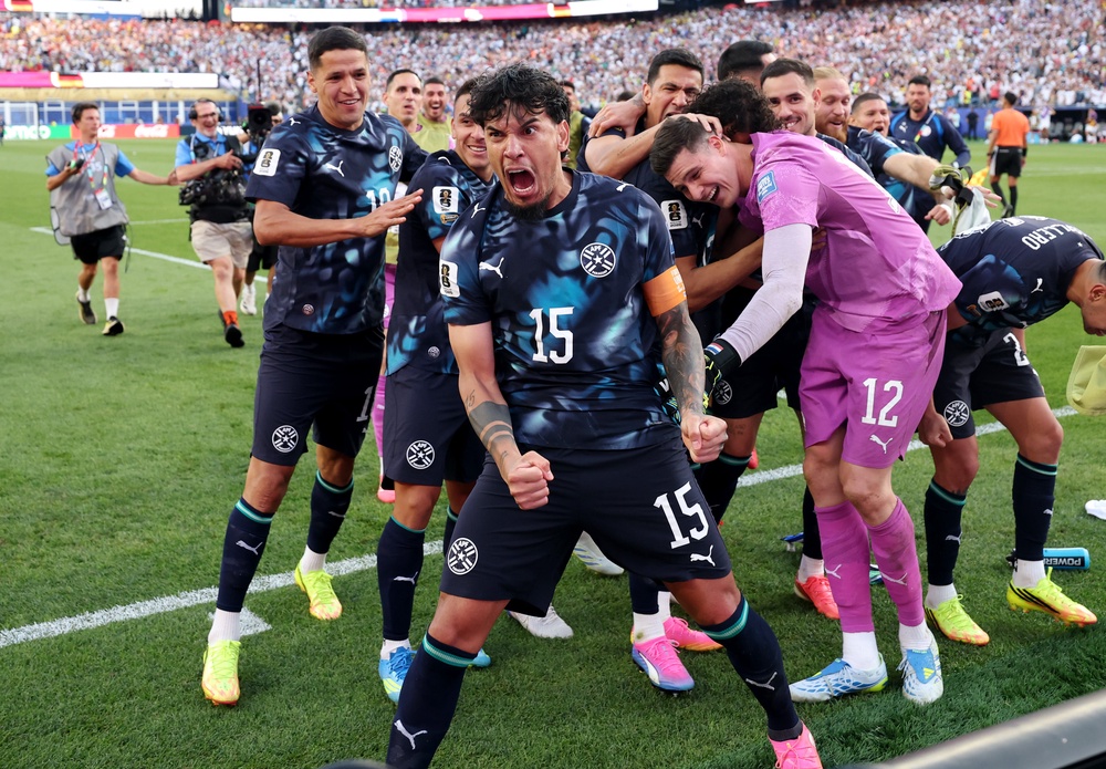 Paraguay players celebrate knocking Germany out of the World Cup (Getty)