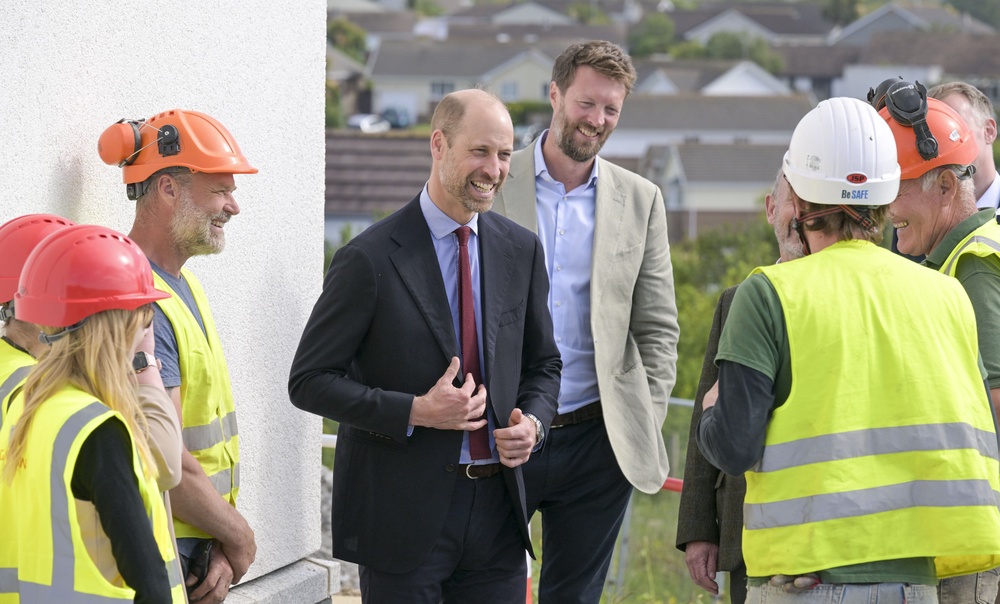 The Prince of Wales speaks with staff during a visit to a Duchy of Cornwall housing development in Tretherras, Cornwall, to mark the final stages of a project that includes homes purpose-built to address homelessness earlier this year (PA) (PA Wire)