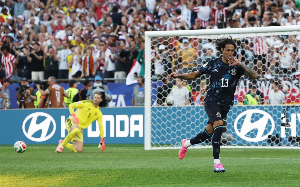 Paraguay's Jose Canale celebrates scoring a penalty during the penalty shootout to win the match (Reuters)