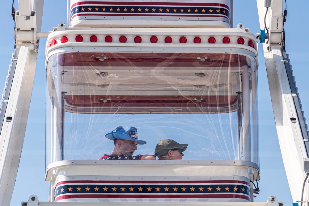 A Ferris wheel appears to be one of the main draws at the Great American State Fair, which has struggled with empty booths and weather delays (AP)