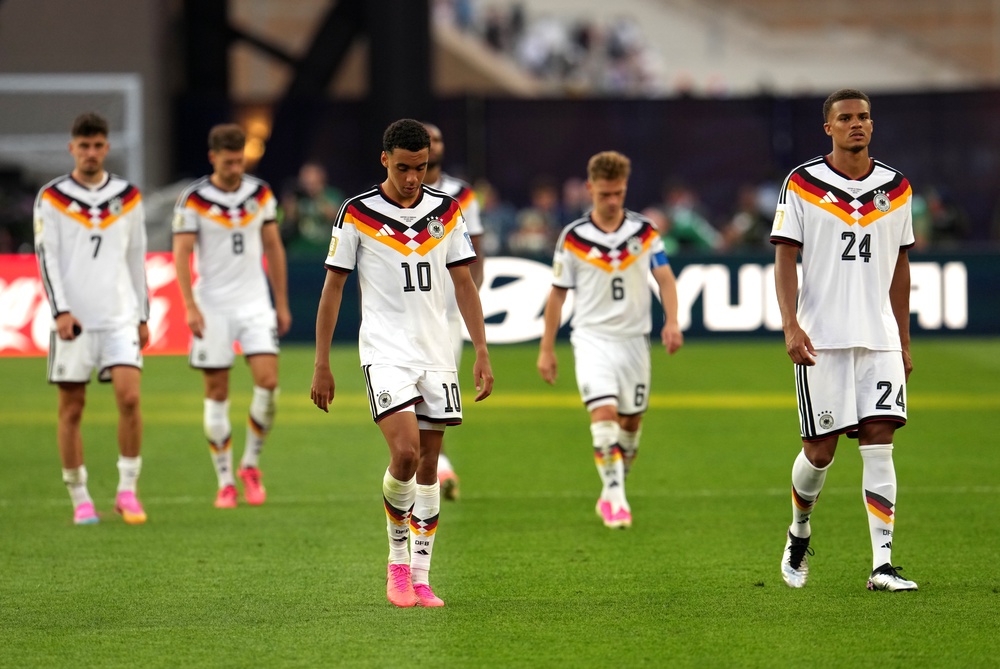 Germany's Jamal Musiala appears dejected after defeat (PA)