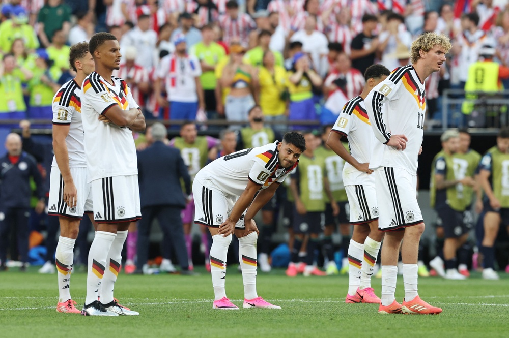 Germany's Nick Woltemade, Malick Thiaw and Nadiem Amiri react (Reuters)