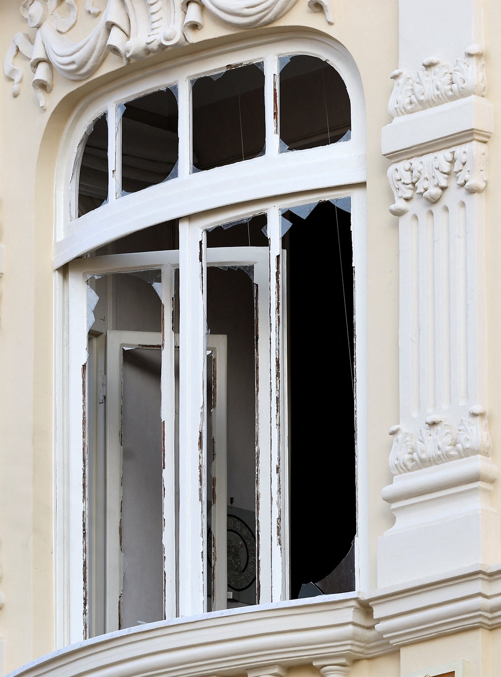 Shards of glass on a damaged window of a residential building, following an explosion on Monday (Reuters)