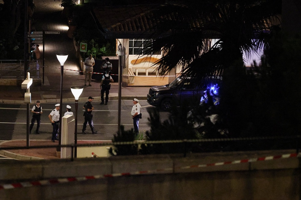Police officers stand guard after an explosion was reported, on Boulevard d’Italie, in Monaco (Reuters)