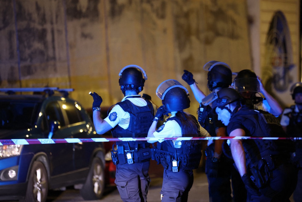 Monaco police officers patrol near the site of an explosion in a residential building in Monaco, near the French border (AFP/Getty)