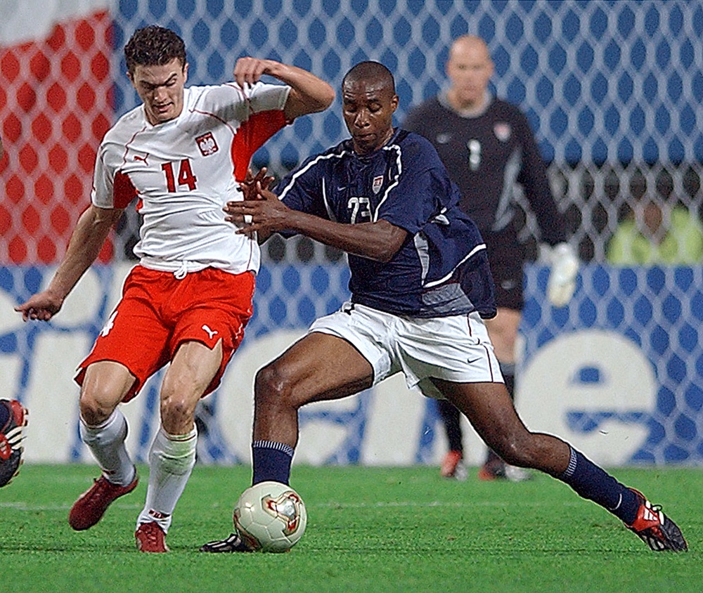 Polish forward Marcin Zewlakow (L) clashes with US defender Eddie Pope (R) during their Group D match at the 2002 FIFA World Cup Korea/Japan (AFP/Getty)