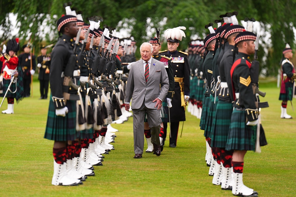 Charles inspects the guard of honour provided by Balaklava Company, 5th Battalion, the Royal Regiment of Scotland (Aaron Chown/PA) (PA Wire)