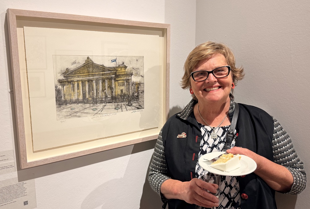 Artist Kate Downie with her Royal Scottish Academy cake cut by Queen Camilla during her visit to see the exhibition of Chaos and Control, Printmaking in Scotland Now (Craig Meighan/PA) (PA Wire)