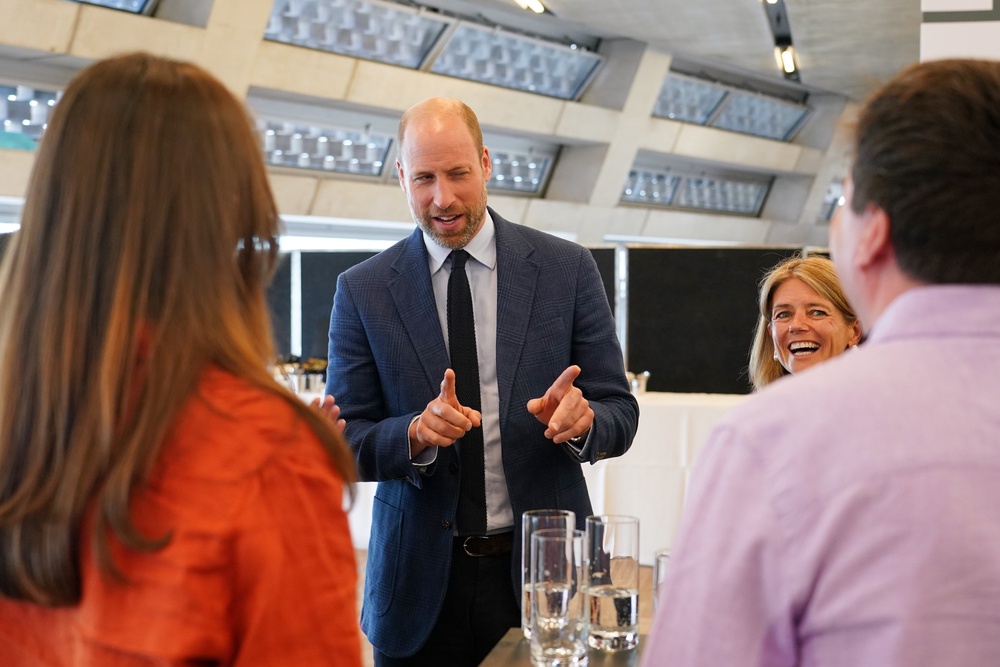 The prince talks to participants at the Homewards event (Alberto Pezzalli/PA) (PA Wire)