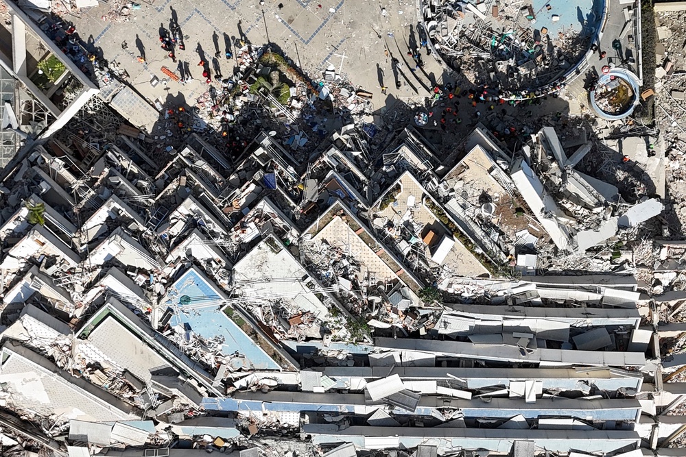 A collapsed multi-storey building and surrounding debris near a coastal road following the June 24 twin earthquakes in Caraballeda, La Guaira State, Venezuela, on June 29, 2026. (AFP/Getty)