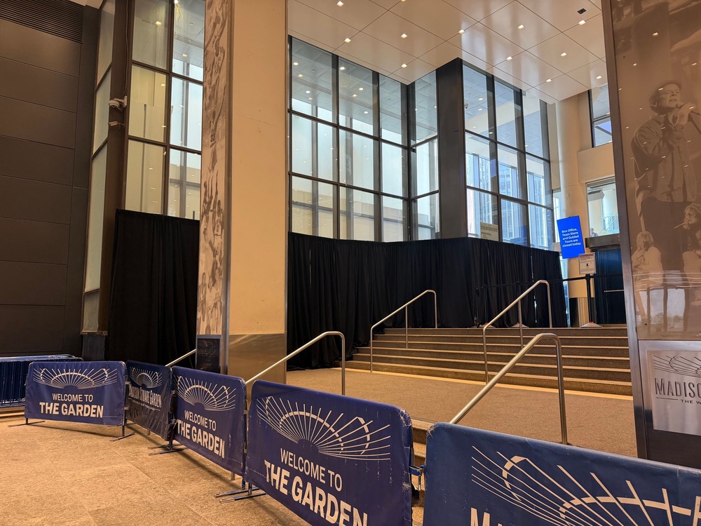 Blackout curtains line the ground-level windows near a now-cordoned-off entrance to Madison Square Garden on Seventh Avenue off W. 33rd Street Tuesday in preparation for the potential wedding of Taylor Swift and Travis Kelce (Elle Muir/The Independent)