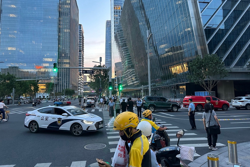 Police keep watch near CITIC Tower in Beijing (AFP/Getty)