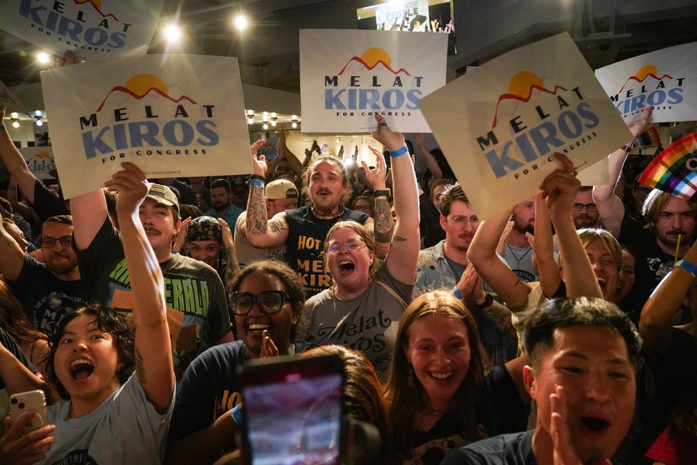 Attendees celebrate Kiros' shock victory on Tuesday night (AP)