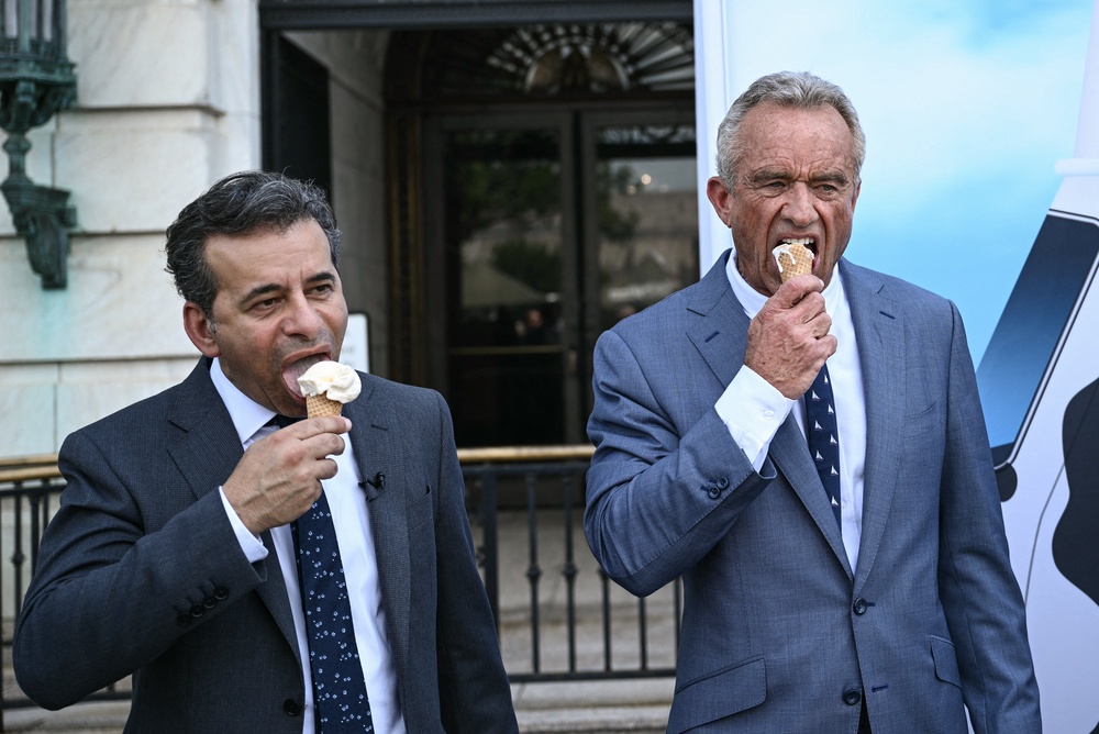 Food and Drug Administration Commissioner (FDA) Martin Makary and Secretary of Health and Human Services Robert F. Kennedy Jr., eat ice cream at the end of a news conference at the USDA headquarters building (AFP/Getty)