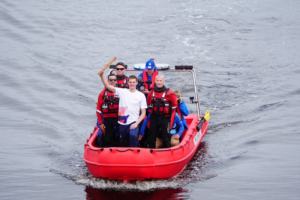 Duncan Scott held the baton aloft as he sailed down the Clyde on Wednesday morning (Jane Barlow/PA) (PA Wire)