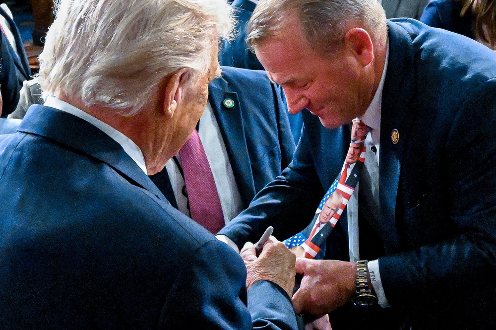 During the State of the Union address in February, Nehls wore a tie emblazoned with Trump’s face — and asked the president to sign it (Getty Images)