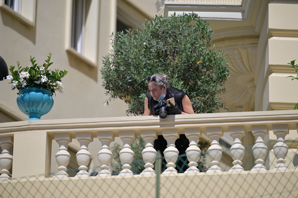 An investigator examines the scene at the residential building where an explosive device seriously injured three people (AP)
