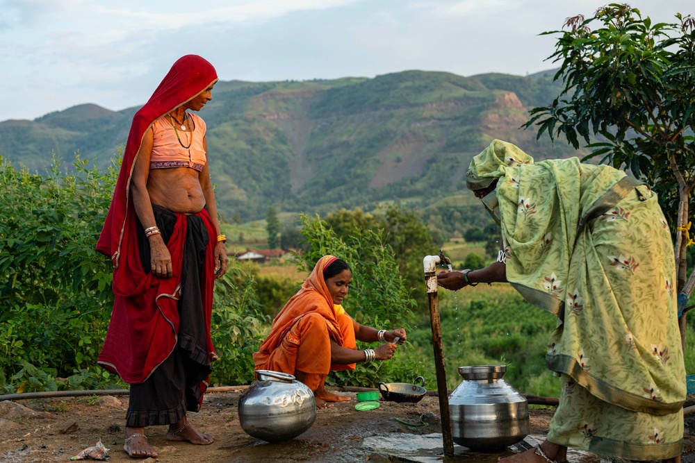 Women prepare to fill pots with water from a borewell in Nashik, India (AFP/Getty)