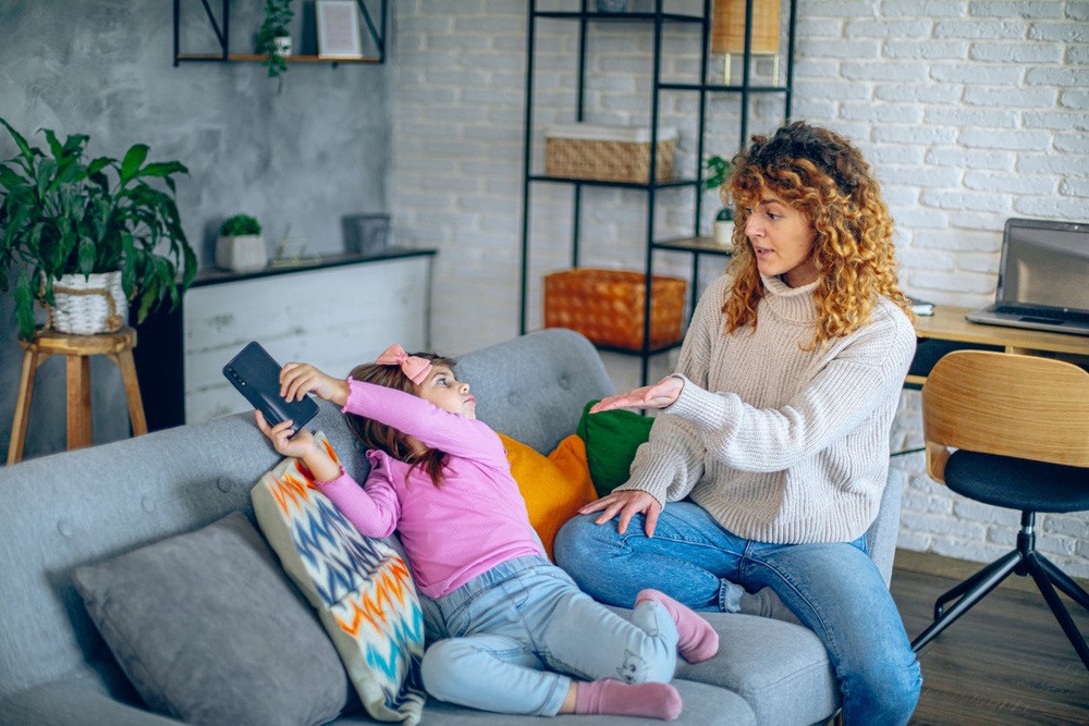 Children follow the example of their parents, so a key aspect of getting them to put their devices down is for parents to do it first (Getty/iStock)