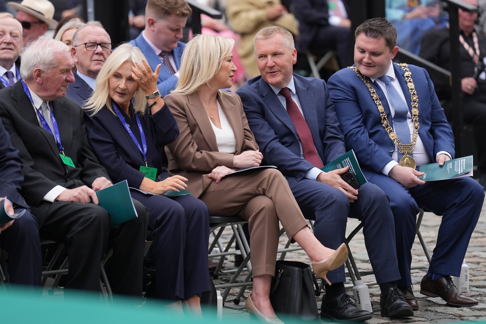 Former taoiseach Bertie Ahern, left, and Sinn Fein vice president and Stormont First Minister Michelle O’Neill, centre, were among the crowd (Niall Carson/PA) (PA Wire)