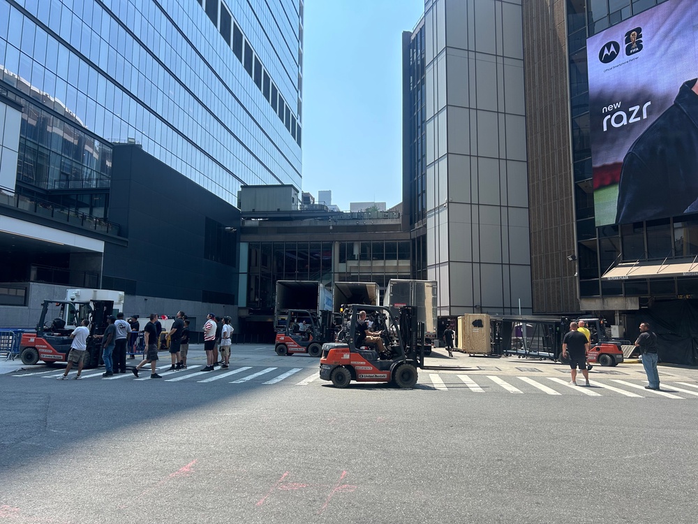 Trucks full of equipment were parked outside of the New York City venue Wednesday as forklift drivers helped to unload the hidden structures (Carsen Holaday/The Independent)