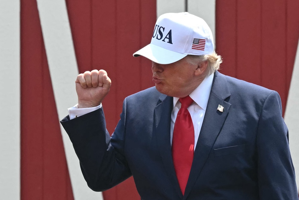 Trump arrives to speak at the Burning Hills Amphitheatre after attending the opening of the Theodore Roosevelt Presidential Library (AFP via Getty Images)