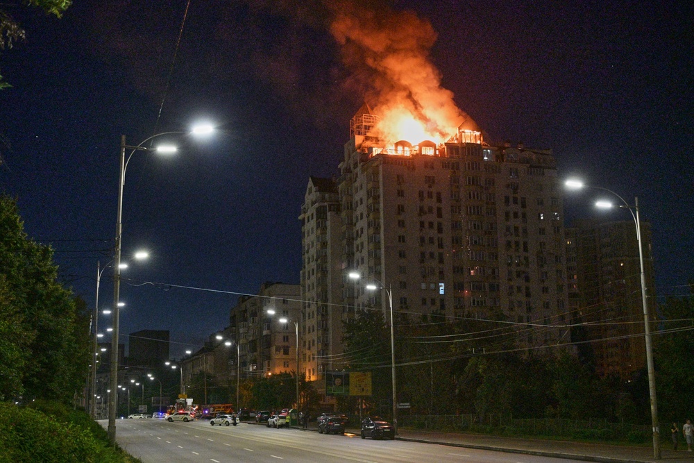 An apartment building burns following a Russian missile attack in Kyiv (AP)