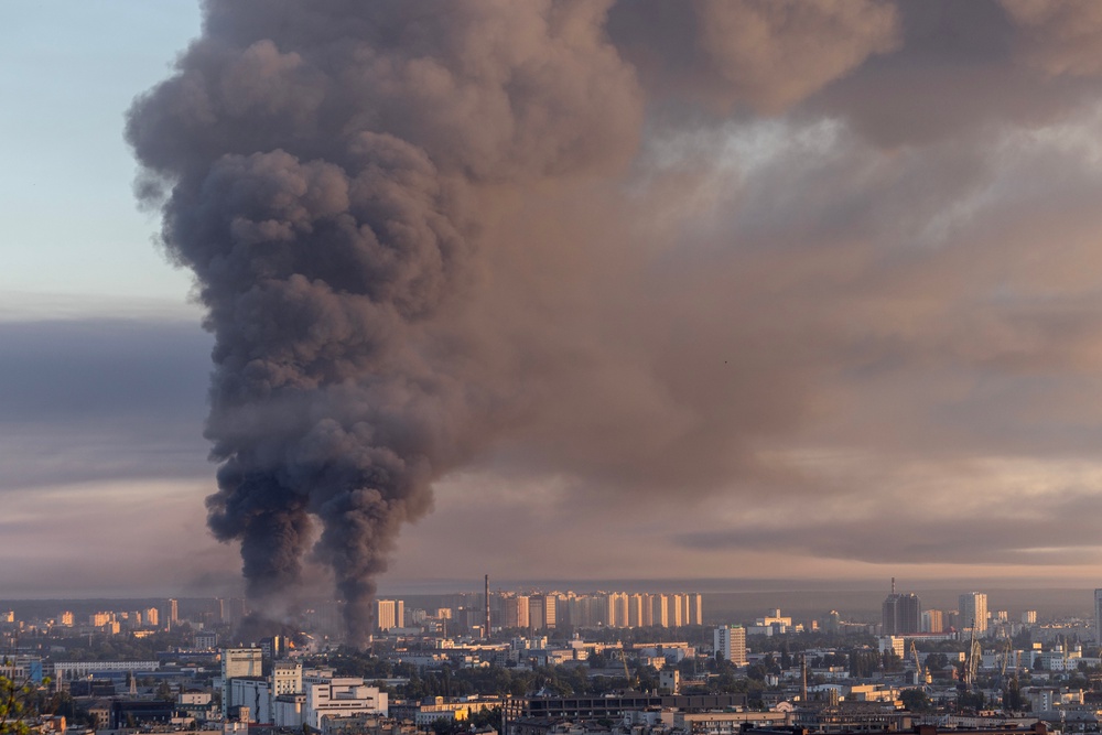Smoke is seen as two major fires burn after a drone and missile attack by Russian forces on 2 July (Getty)