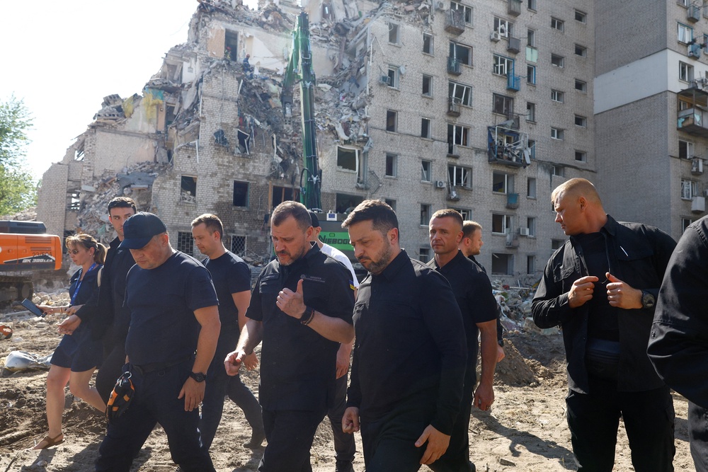 Volodymyr Zelensky walks through Kyiv with interior minister Ihor Klymenko as he surveys the damage (Reuters)