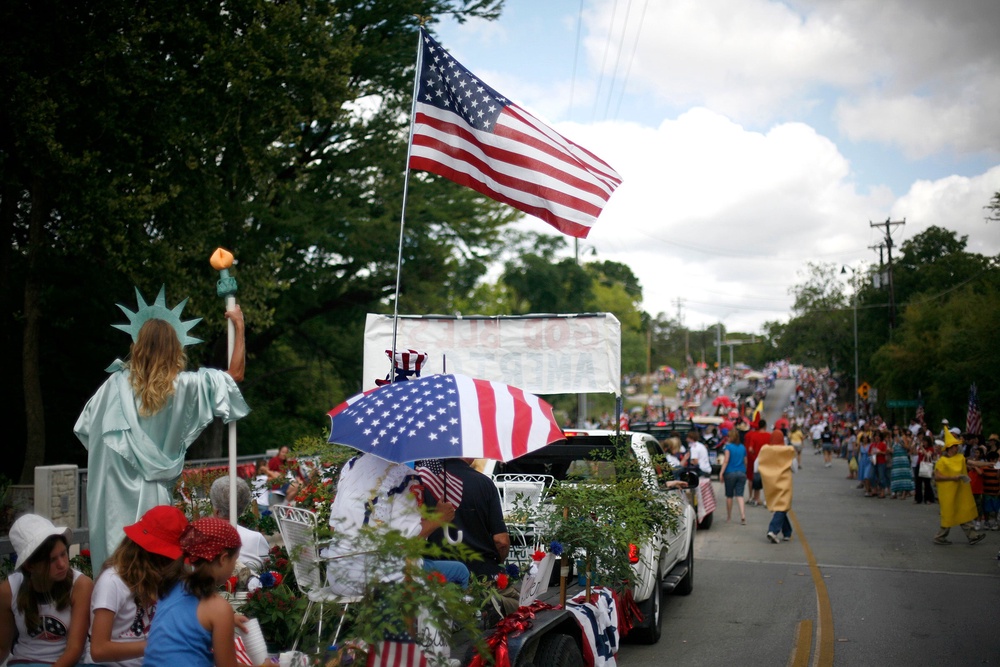 This year’s procession down Ranch Road 12 features more than 100 entries — the largest in Wimberley history — led by local veterans in a vintage Army truck (Getty Images)