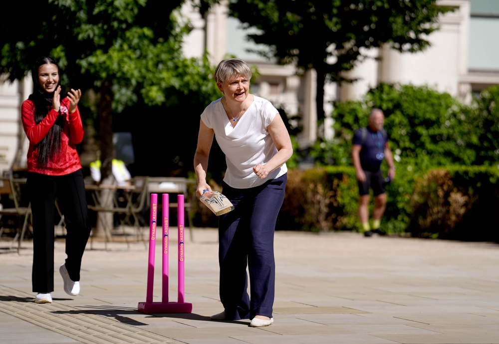 Yvette Cooper plays a game of cricket with members of the Afghan refugee women’s cricket team (Jordan Pettitt/PA) (PA Wire)