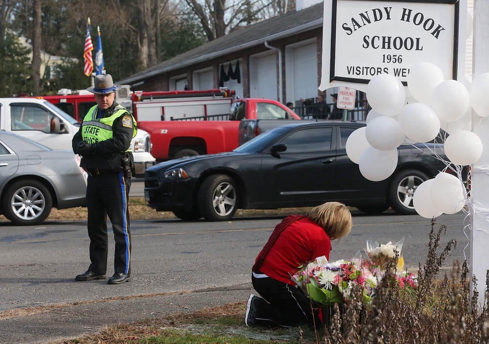 A memorial for the 2012 Sandy Hook Elementary School shooting. Americans moving abroad with children are citing gun violence as one of the reasons behind their decision (Getty)