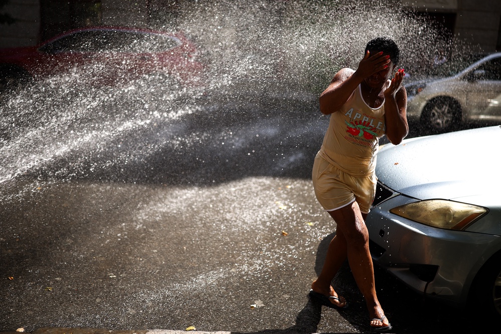 People should douse themselves with cold water if they experience symptoms of heat illness, such as dizziness or a fast but weak pulse (AFP/Getty)