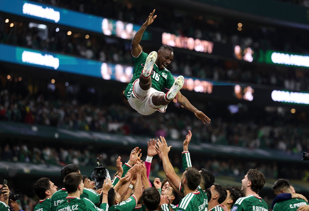 Julian Quinones #16 of Mexico is thrown in the air by team mates as they celebrate after the team's victory (Getty Images)