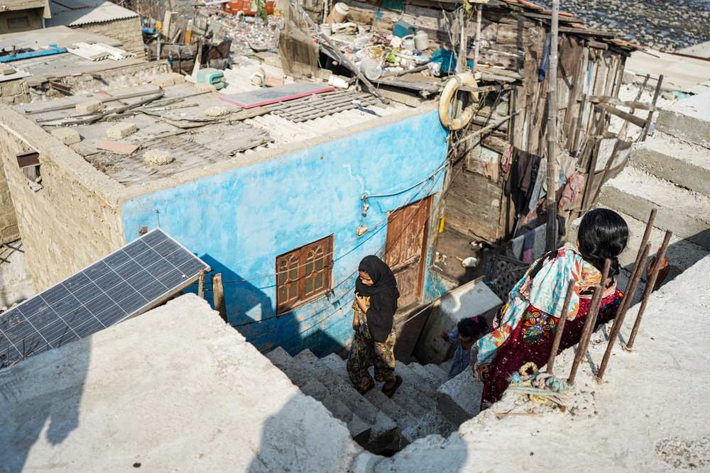 Some 25,000 people are packed into a single square kilometre of tightly-packed concrete on Baba Island, with little vegetation and only unreliable electricity (Neha Mankani)