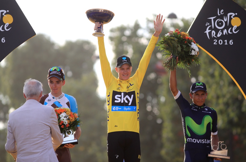 Chris Froome celebrates as he collects the yellow jersey for winning the Tour De France in 2016 (John Walton/PA) (PA Archive)