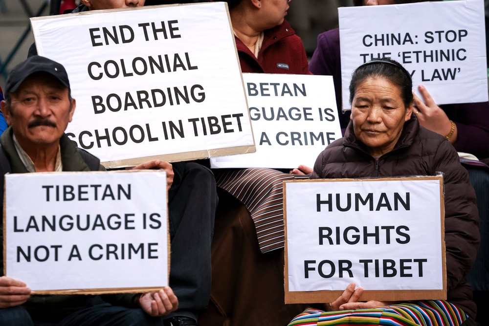 File. Members of the Australian Tibetan community react as they hold placards during a protest in Sydney on 1 July 2026 (AFP/Getty)