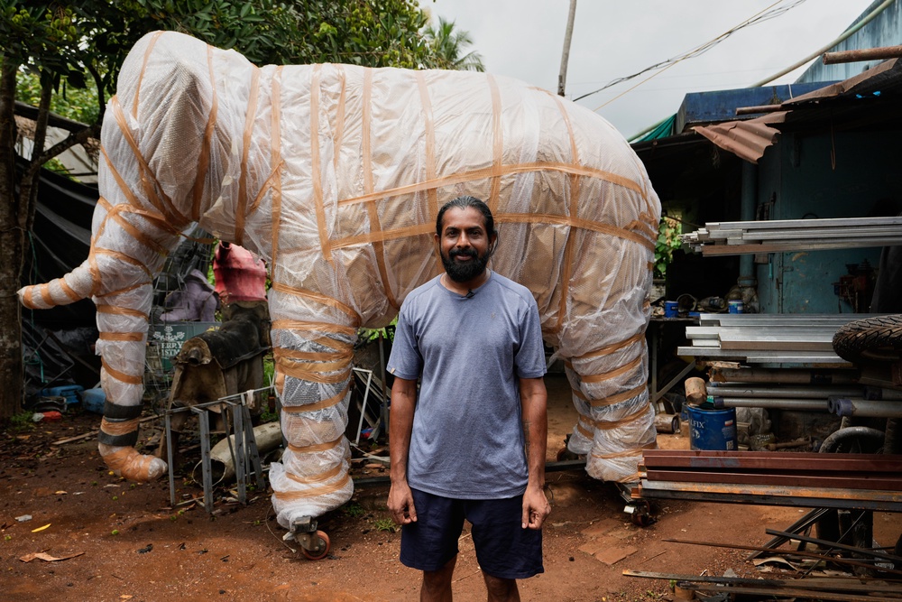 Prasanth Prakashan, a mechanical engineer, poses in front of a robotic elephant at his backyard workshop in Chalakudy, in the southern Indian state of Kerala, Friday, May 22, 2026. (AP Photo/Aijaz Rahi) (Copyright 2026 The Associated Press. All rights reserved)