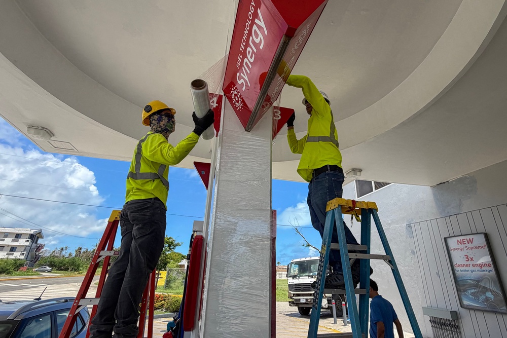 Workers secure a gas station ahead of the arrival of the forecasted Super Typhoon Bavi in Saipan, Northern Mariana Islands (AFP/Getty)