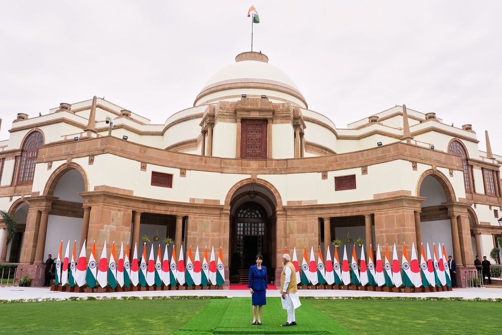 Japanese Prime Minister Sanae Takaichi, left, and Indian Prime Minister Narendra Modi prepare to leave after posing for photographs before their delegation level meeting in New Delhi, India, Thursday (AP)