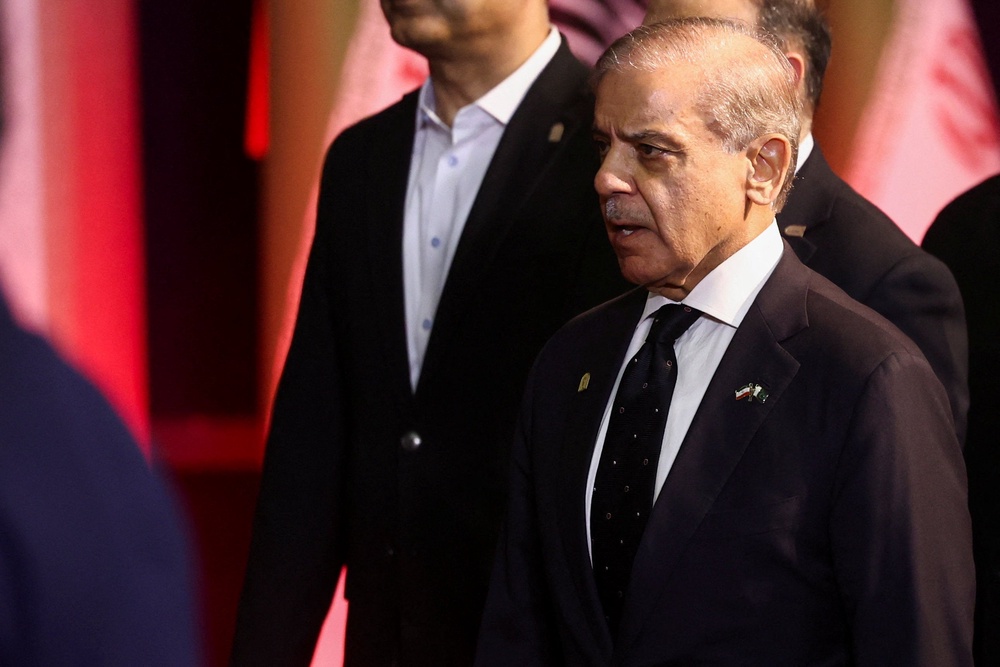 Pakistani Prime Minister Shehbaz Sharif attends the ceremony at the Imam Khomenei Grand Mosalla in Tehran on Friday (Reuters)