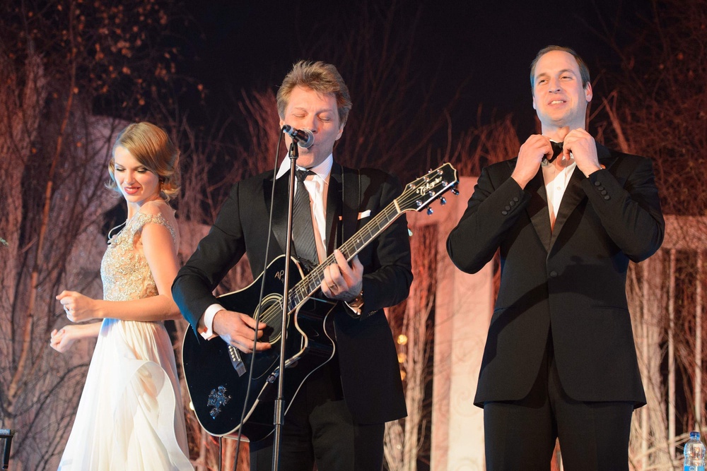 William (right) sings with Taylor Swift and rock star Jon Bon Jovi at the Centrepoint Gala Dinner at Kensington Palace in 2013 (Dominic Lipinski/PA) (PA Archive)