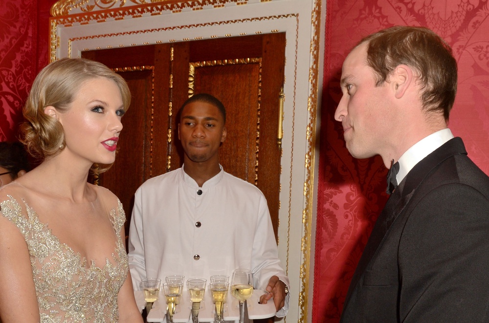 William and Swift chatted at a gala for the Centrepoint charity at Kensington Palace in 2013 (PA)