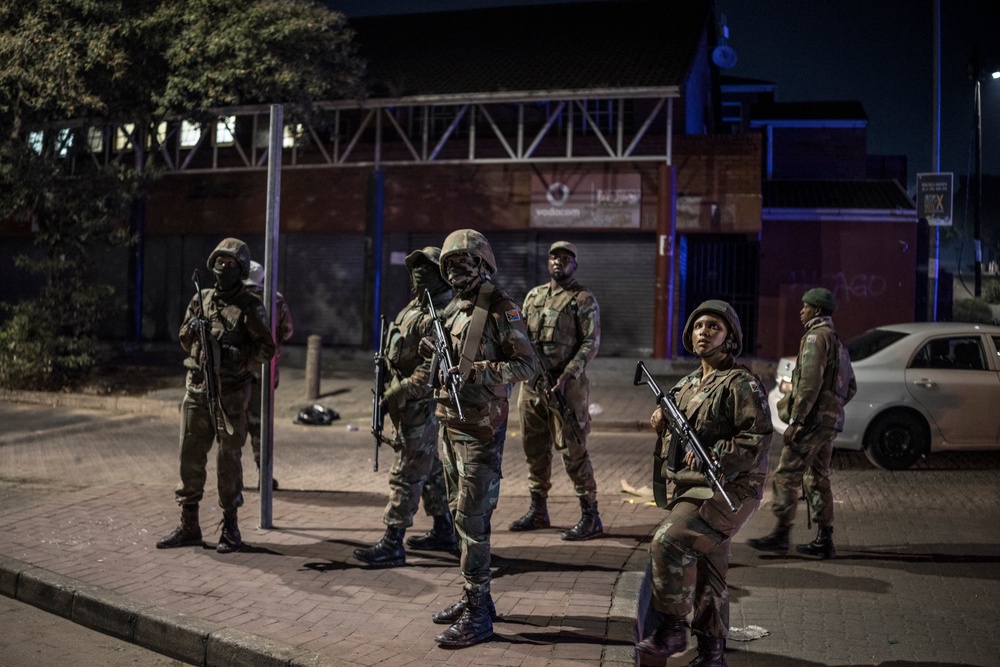 The protests have also been marked by looting. In this picture, soldiers with the South African National Defence Forces (SANDF) patrol an area where looting took place in the Umlazi area of Durban (AFP/Getty)