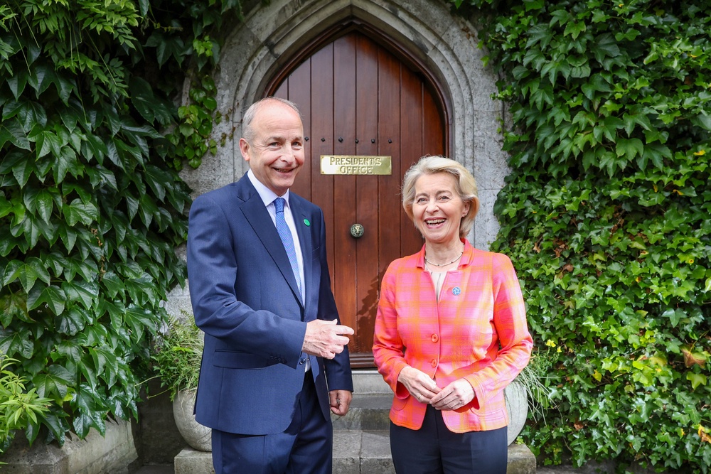 European Commission President Ursula von der Leyen and Taoiseach Micheal Martin outside the president’s office door at University College Cork (Paul Faith/PA) (PA Wire)
