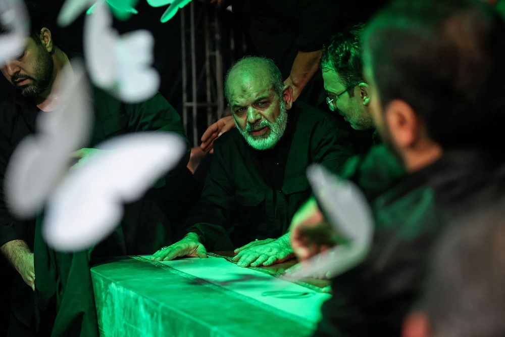 This handout photograph provided by the Iranian supreme leader office (Khamenei.IR) shows the chief of Iran's Revolutionary Guards, Ahmad Vahidi (C) paying respect at the coffin of Iran's slain supreme leader Ali Khamenei during a ceremony ahead of his funeral in Tehran on July 3, 2026. Vahidi paid his respects in Tehran before the body of Ali Khamenei, his first public appearance since the start of the Middle East war, footage broadcast on July 3 by Iranian media showed (AFP/Getty)
