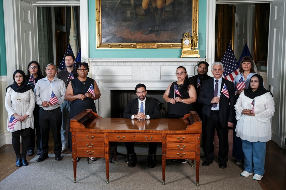The mayor, surrounded by a group of new US citizens, said the ideals enshrined in the nation’s founding principles are ‘strong enough to endure any authoritarian regime’ (AP)